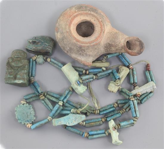 An Ancient Egyptian beadwork necklace, beads and oil lamp